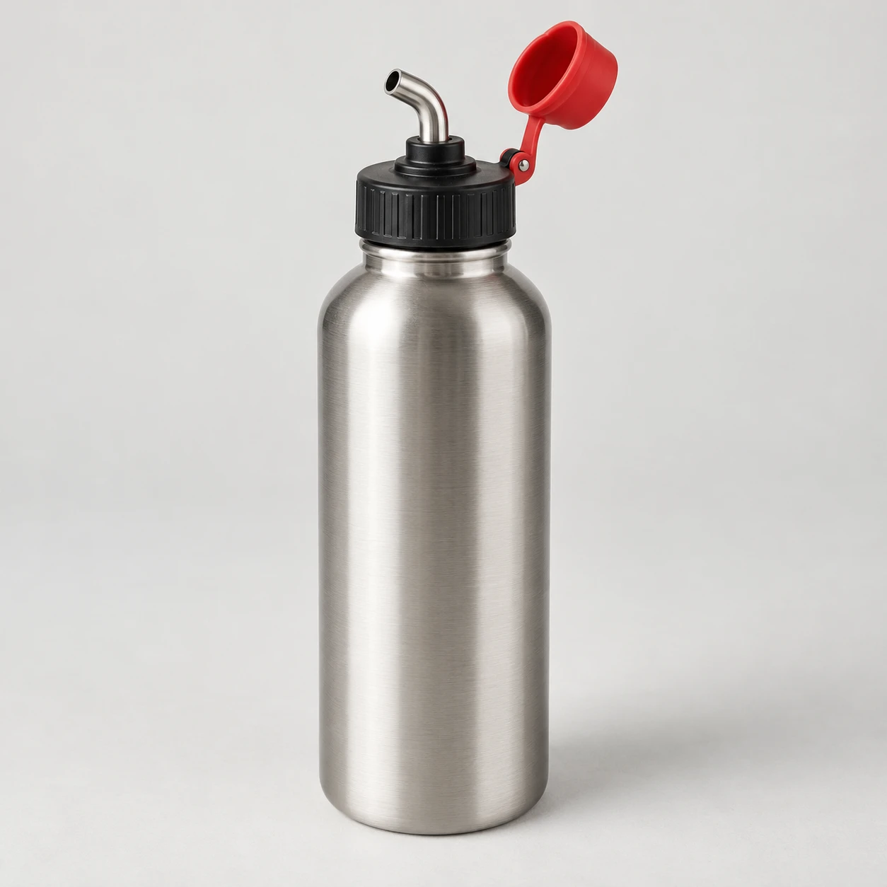 Brushed steel bottle with a fountain-style spout, black cap and open red spout cover.