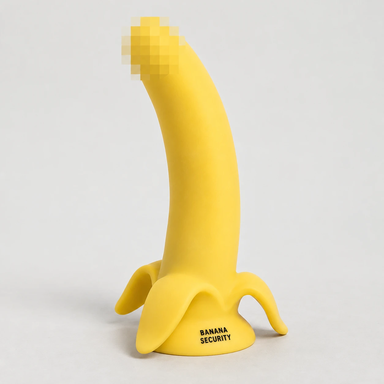 Yellow banana-shaped silicone object with a pixelated tip and Banana Security lettering.